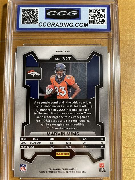 Marvin Mims CCG 10 2023 Panini Prizm Orange Lazer Silver RC 327