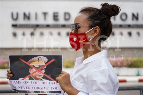 Female Protester Hold Portraits Of Min Aung Hlaing The Shot