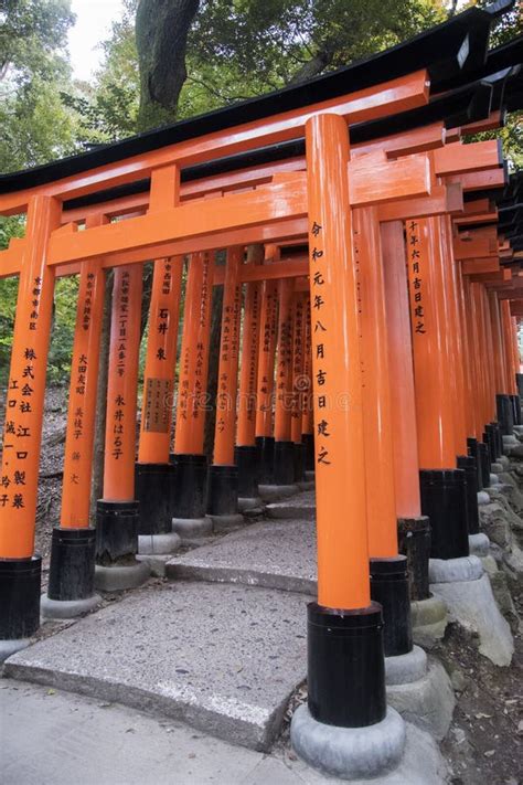 Torii Gate Pathway With Japanese Architecture At Fushimi Inari Shrine