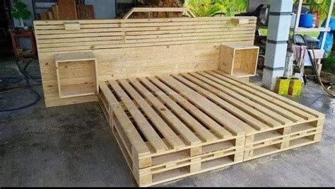 A Bed Made Out Of Wooden Pallets With No Sheets Or Mattresses On It