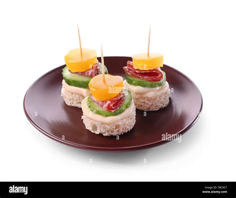 Plate With Tasty Canapes On White Background Stock Photo Alamy