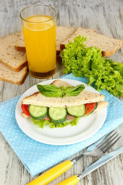 Premium Photo Composition With Fruit Juice And Tasty Sandwich With