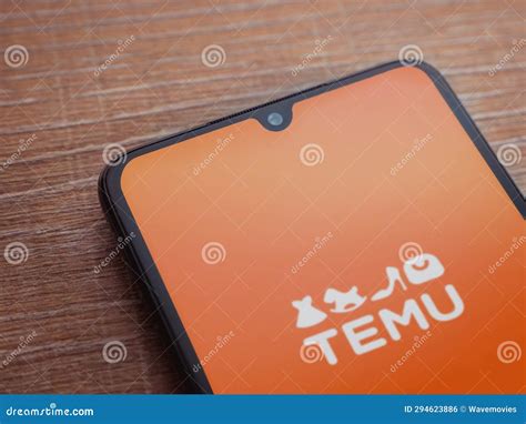 Temu App Launch Screen On Smartphone On Wooden Background Editorial