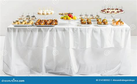 Elegant Banquet Table Setup With Assorted Gourmet Appetizers Stock