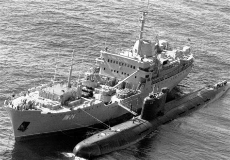 An Elevated Port Bow View Of A Soviet Tango Class Submarine Alongside