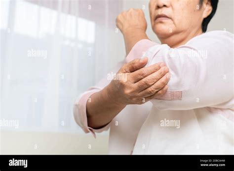 Elbow Pain Old Woman Suffering From Elbow Pain At Home Healthcare