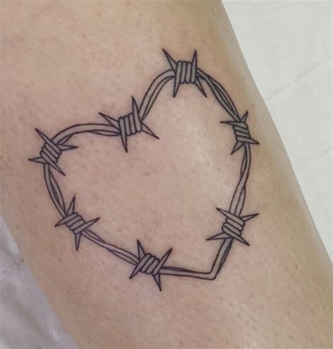 A Tattoo With Barbed Wire In The Shape Of A Heart