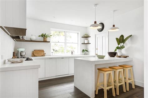 Costal Kitchen With V Groove Cabinets And White Benchtops Beach Style