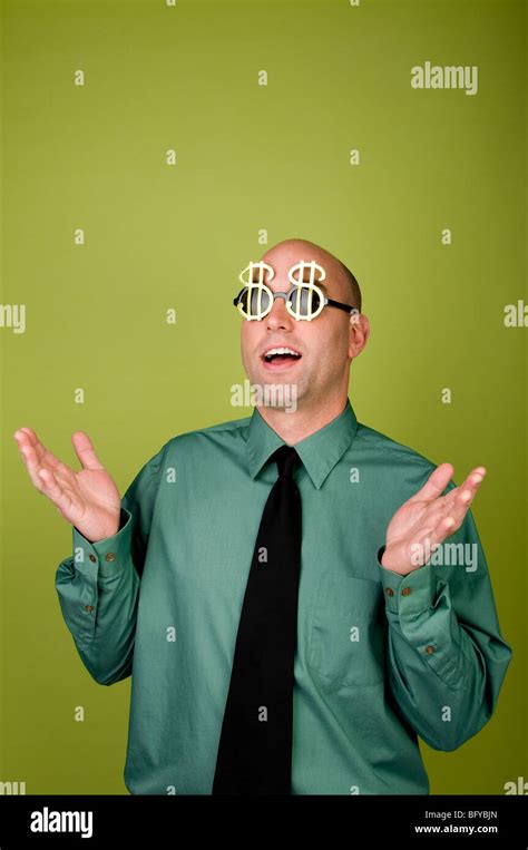 Businessman Wearing Dollar Sign Sunglasses And Looking Surprised Stock