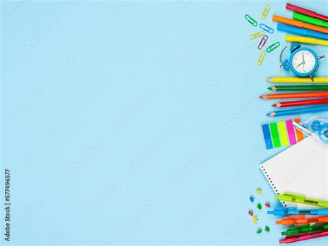 Variety Of School Supplies On Blue Background Back To School Concept