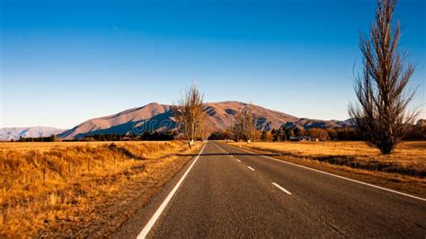 Scenic Winding Road Along Lake Pukaki To Mount Cook National Park