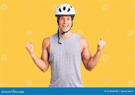 Young Handsome Man Wearing Bike Helmet Celebrating Surprised And Amazed