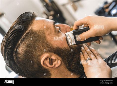 Hipster Man At Barbershop Salon Getting Beard And Hair Cut