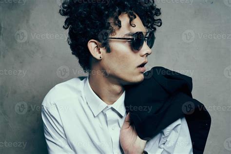 handsome man with glasses curly hair fashion self confidence 22065636 ...