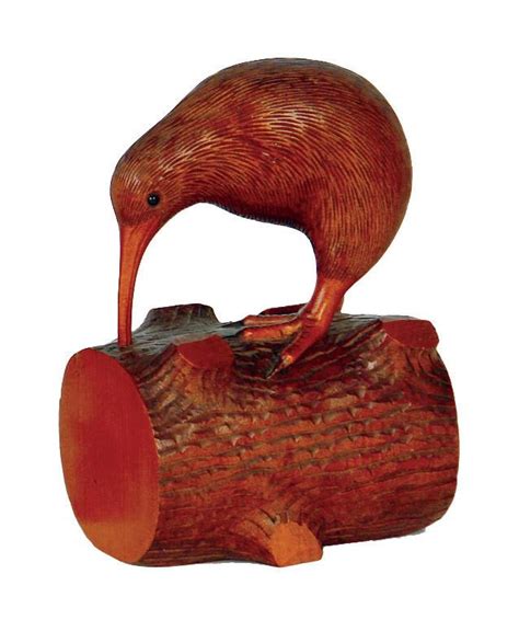 A Vintage Carved Kauri Kiwi On A Log Traditionally Represented