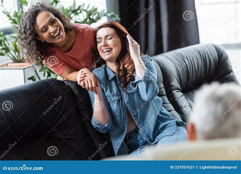 Excited Interracial Lesbian Couple Holding Hands Stock Image Image Of