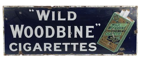 Bonhams Cars : A Wild Woodbine Cigarettes enamel sign,