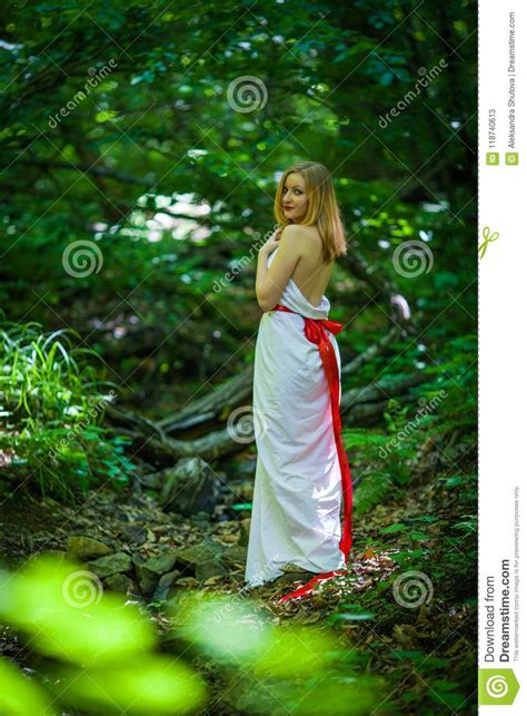 Portrait Of Romantic Blonde Woman In White Dress In Fairy Forest Selective Focus Concept Of