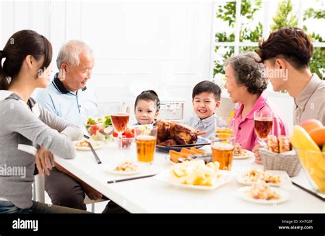 happy asian family having dinner at home Stock Photo - Alamy