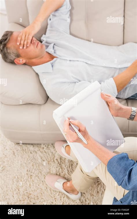 Man Lying On Sofa Therapist High Resolution Stock Photography And