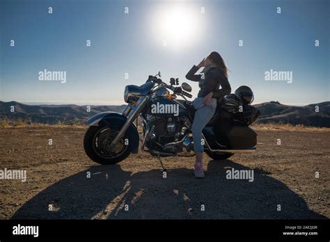 Woman Biker Sitting On Her Motorcycle Stock Photo Alamy