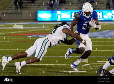 Tulsa Running Back Corey Taylor Ii Right Avoids A Tackle By Tulane