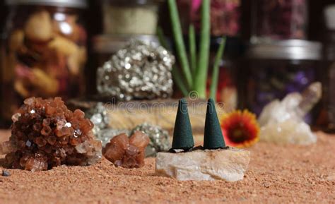 Chakra Stones With Aloe Vera And Incense Cones On Australian Red Sand