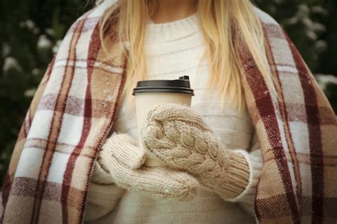 Premium Photo Woman Holds Paper Cup Of Hot Drink Outdoor
