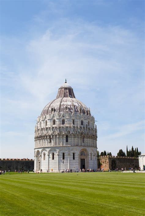 Tourists On Square Of Miracles Visiting Leaning Tower In Pisa Italy