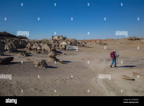 A Solo Female Hikes The Wide Open Badlands Of The San Juan Basin In New