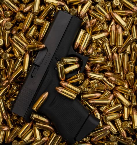 Download Glock On Top Of Bullets Wallpaper