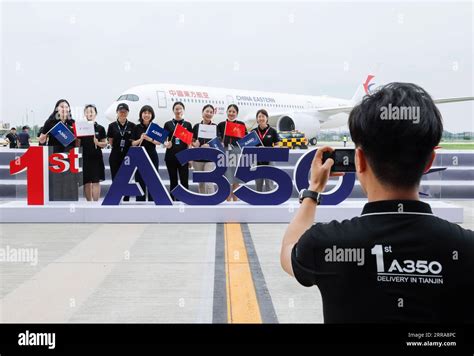 Tianjin July Staff Members Pose For A Group