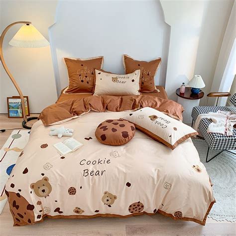 A Bed With Teddy Bears And Cookies On It