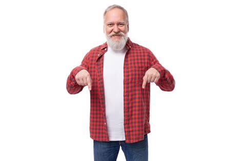 Premium Photo Mature Handsome Grayhaired Man With A Beard Points A