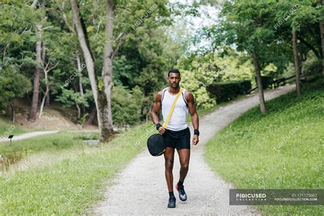 Muscular man walking in park — masculine, footpath - Stock Photo ...