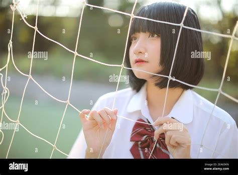 Portrait Of Beautiful Asian Japanese High School Girl Uniform Looking