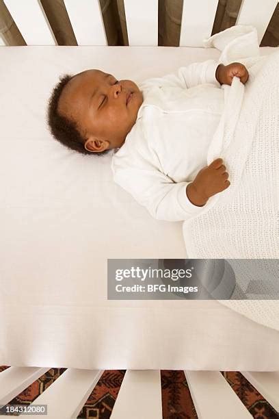 Black Baby Sleeping Crib Photos and Premium High Res Pictures - Getty ...