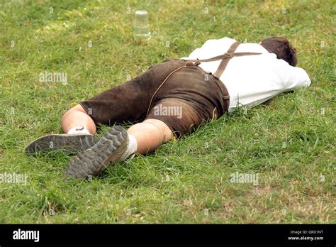 Drunk Man In Lederhose Sleeping At Oktoberfest Stock Photo: 117686068 ...