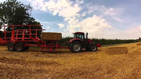 John Deere 7920 With Massey Ferguson 2170 Baling Straw Case IH Puma