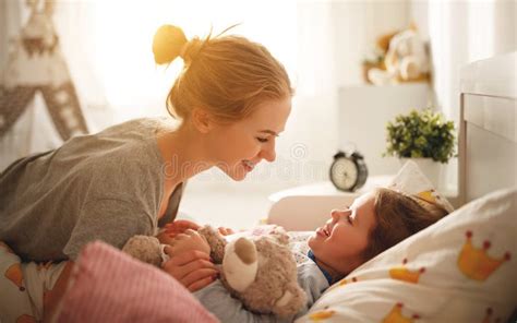 Mother Wakes Her Daughter In Bed In Morning Stock Image Image Of