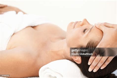 Closeup Of A Beautiful Woman Receiving Head Massage On White High Res