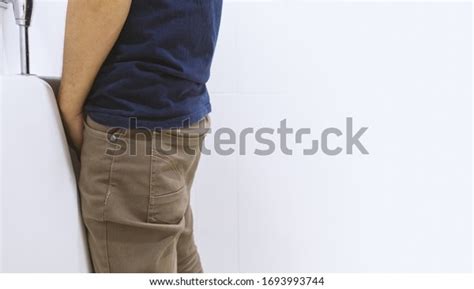 Man Peeing Toilet Bowl Restroom Softfocus Shutterstock