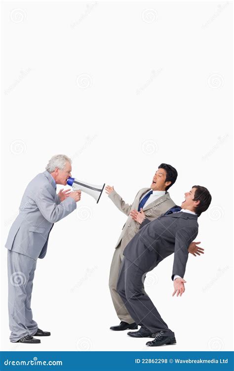 Mature Salesman With Megaphone Yelling At His Employees Stock Photo