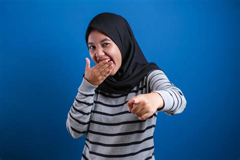 Portrait Of Muslim Girl Wearing Hijab Laughing Hard 5891065 Stock Photo