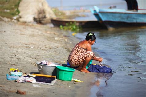 Woman Handwashing Clothes At The Riverside In Myan Editorial Photo ...