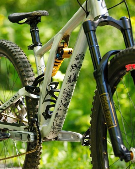 A Close Up Of A Bike With Trees In The Background