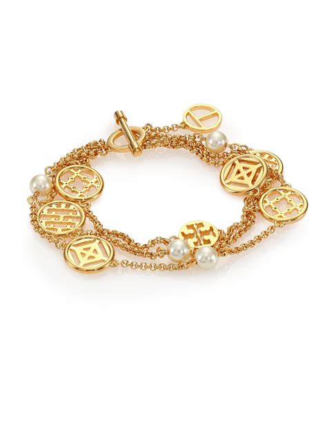 Lyst Tory Burch Charm And Faux Pearl Triple Strand Station Bracelet In