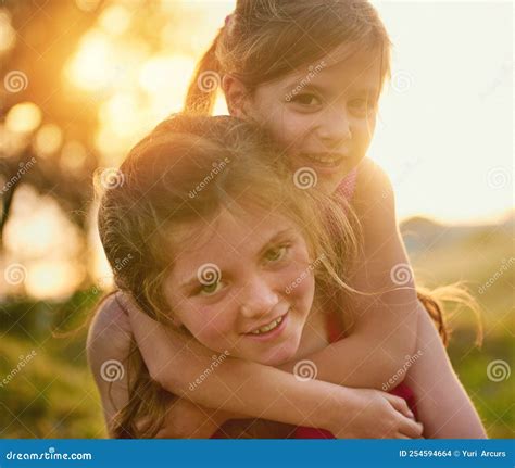 Girls Just Want To Have Fun Portrait Of Two Cute Sisters Playing