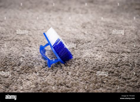 Brush for cleaning on carpet Stock Photo - Alamy