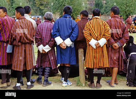 MEN IN TRADITIONAL DRESS THE GHO THIMPU BHUTAN Stock Photo - Alamy